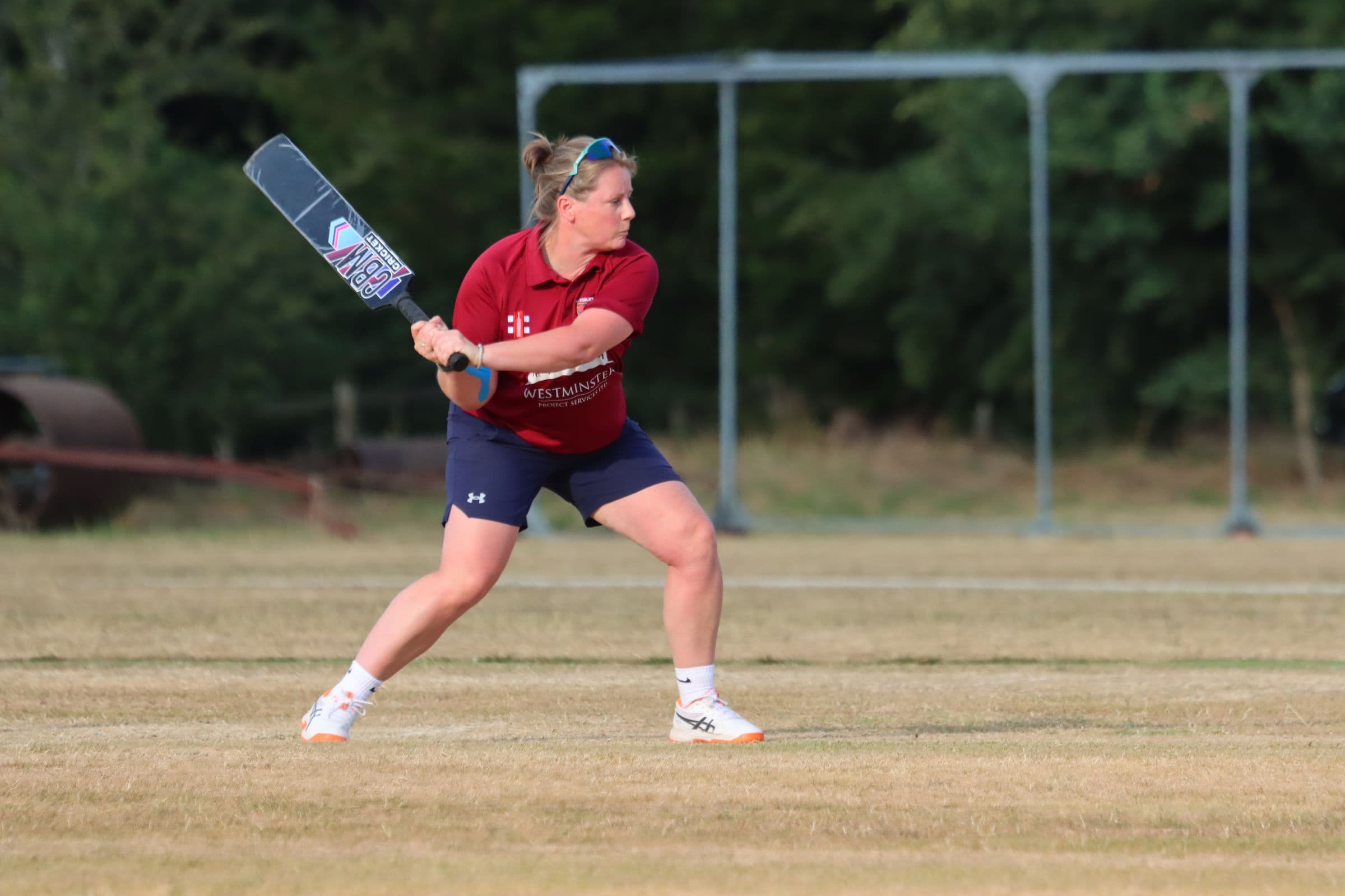 A Tewkesbury player lining up a shot in a softball match