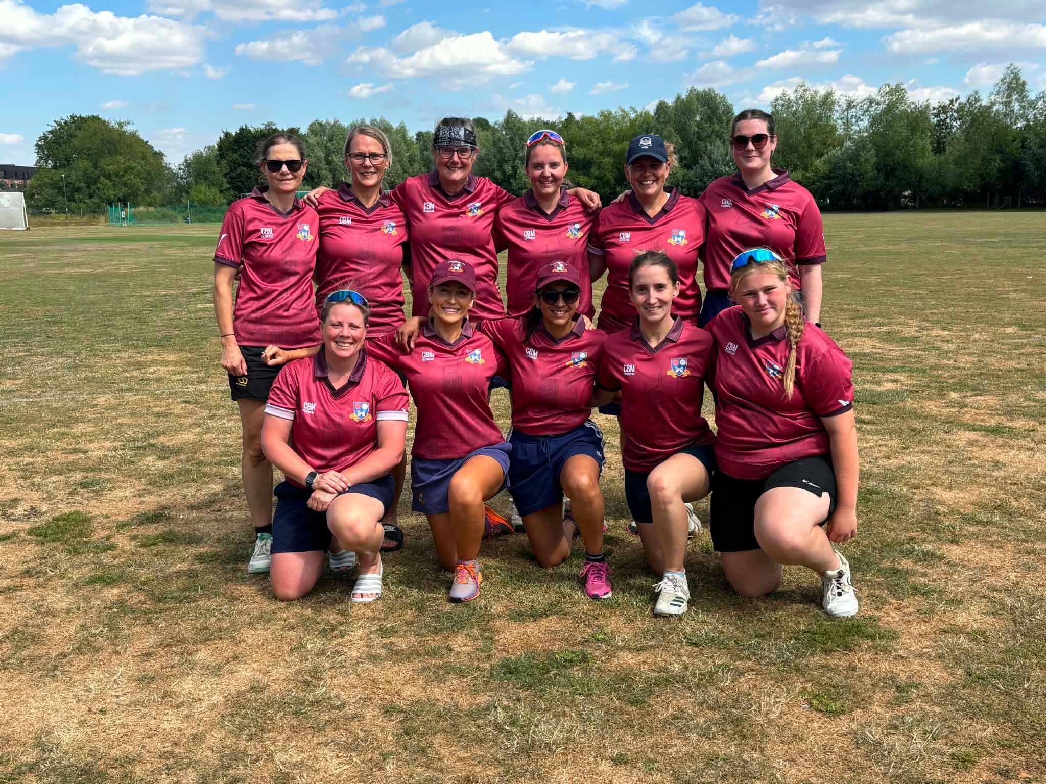 The Tewkesbury women's team in their new maroon kit on a summer afternoon